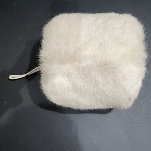 White fur muff [hand warmer]